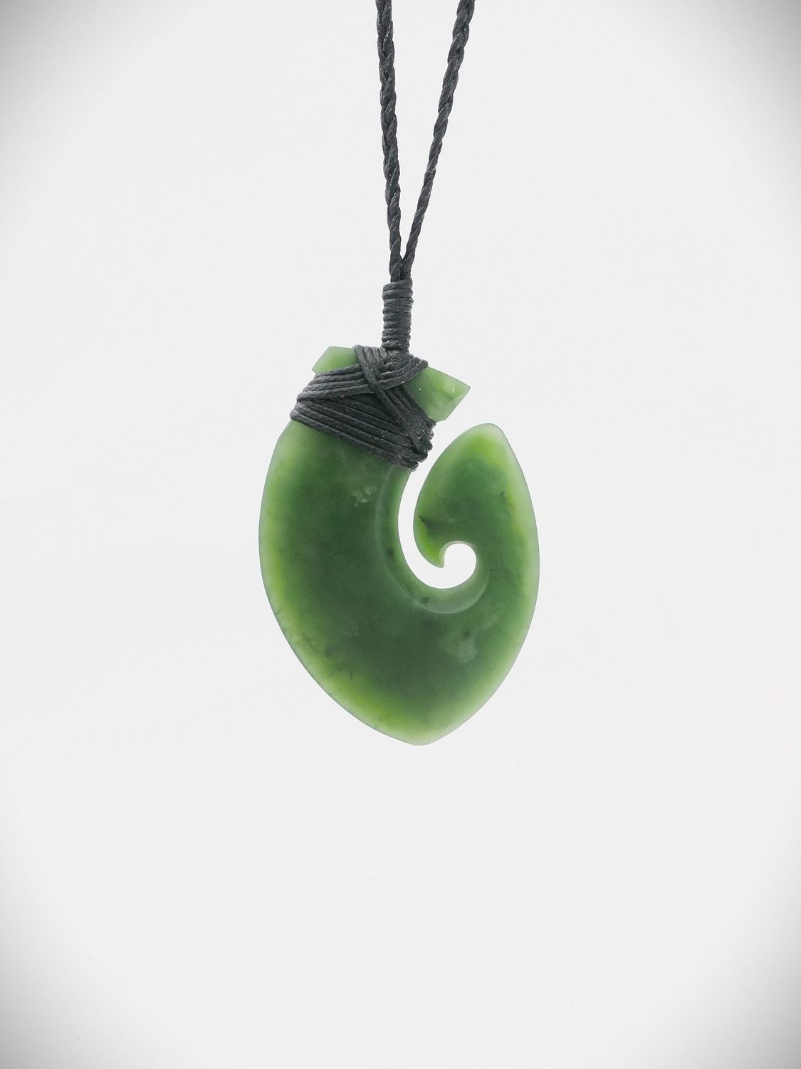 Moko Pounamu Hei Matau (Hook) NZ Genuine Kawakawa Greenstone - Tīraumea Moko Pounamu Hei Matau (Hook) NZ Genuine Kawakawa Greenstone - Tīraumea