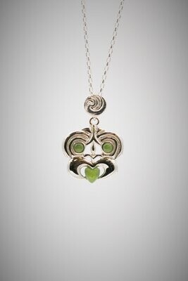 Moko Pounamu Greenstone and Sterling Silver Hei Tiki Pendant Moko Pounamu Greenstone and Sterling Silver Hei Tiki Pendant