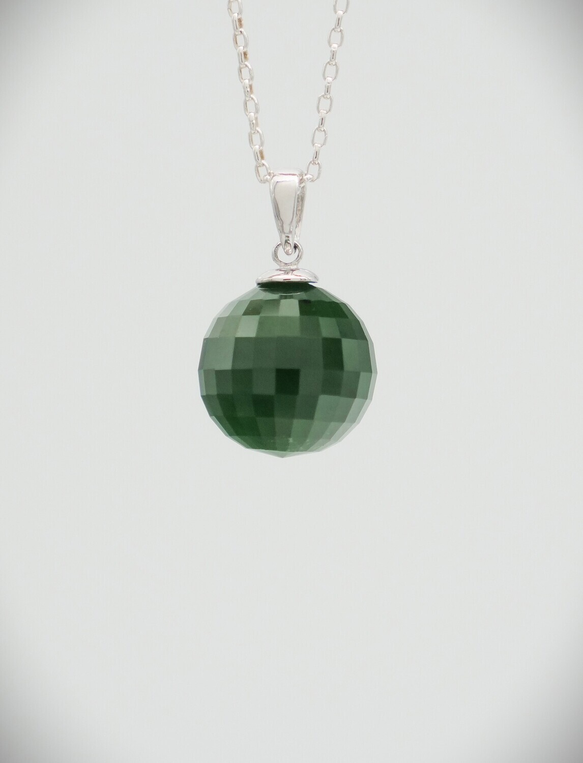 Moko Pounamu Faceted ball Kawakawa Greenstone and Sterling Silver Moko Pounamu Faceted ball Kawakawa Greenstone and Sterling Silver