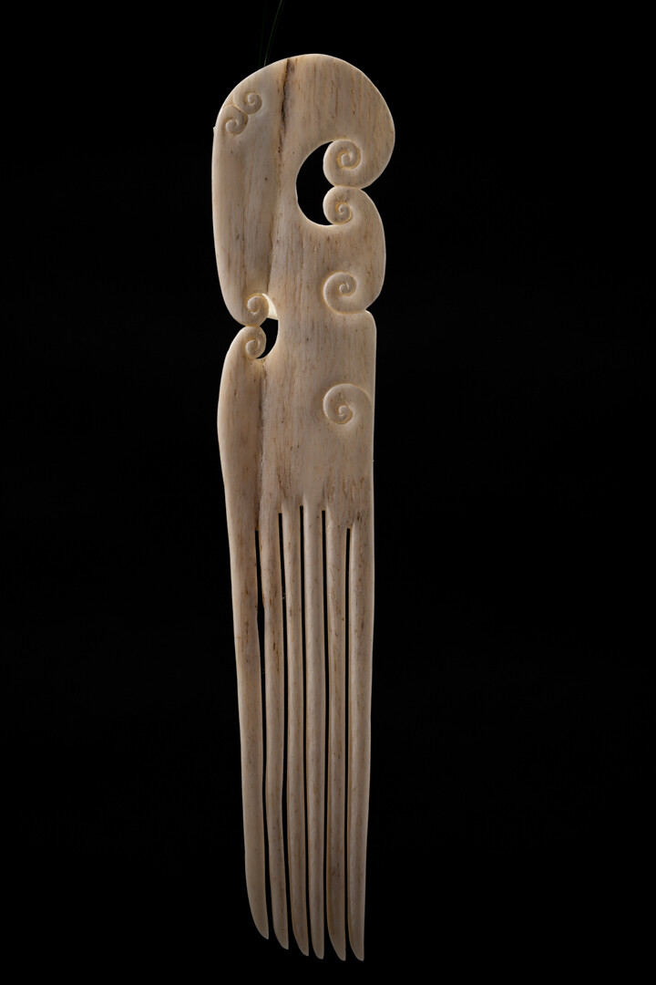 Moko Pounamu Heru Genuine Whale Bone Carving - Rangiauria Moko Pounamu Heru Genuine Whale Bone Carving - Rangiauria