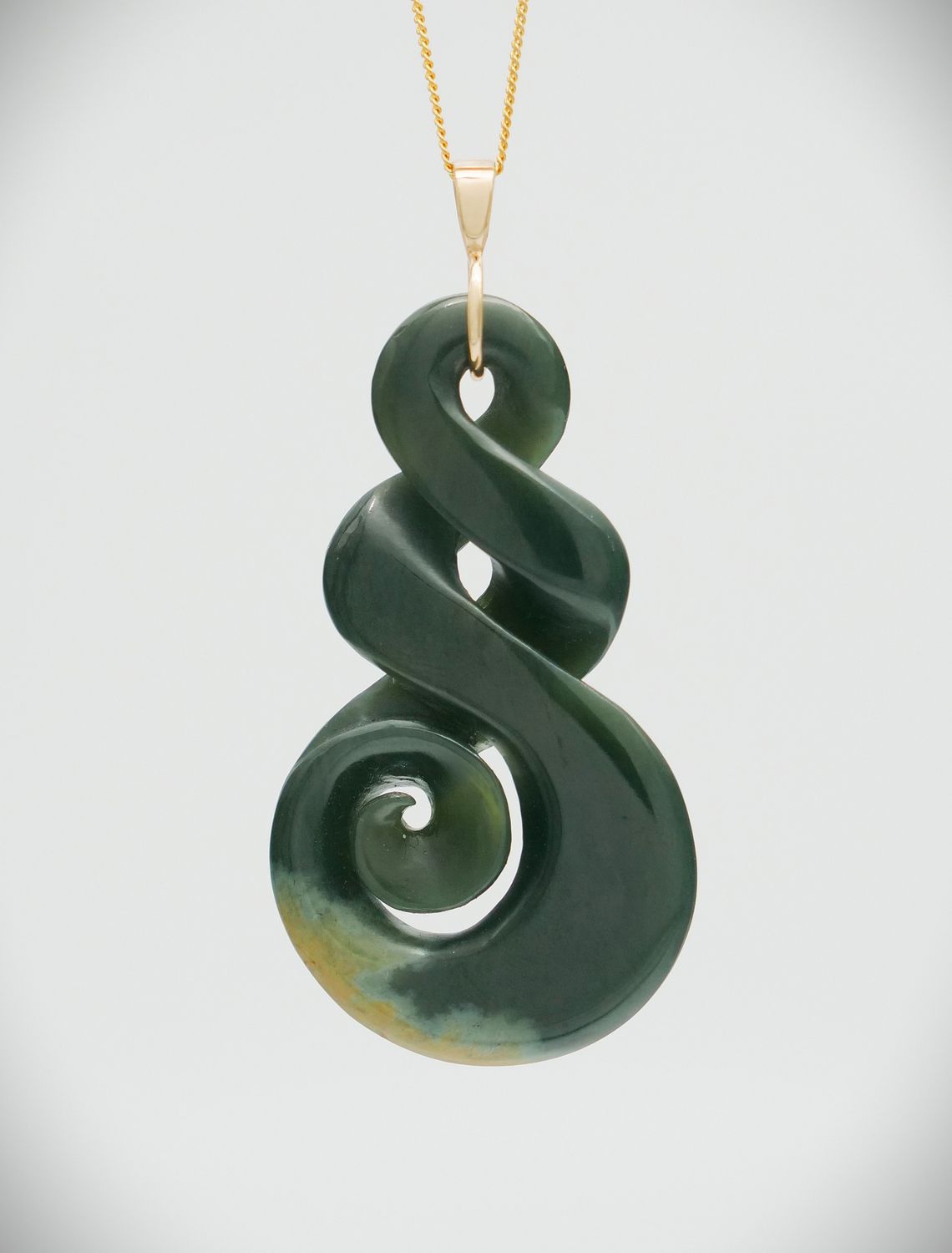 Moko Pounamu Double Pikorua (Twist) with Koru NZ Genuine Kawakawa Flower Greenstone & 9ct Gold Pendant - Pukaki Moko Pounamu Double Pikorua (Twist) with Koru NZ Genuine Kawakawa Flower Greenstone & 9ct Gold Pendant - Pukaki