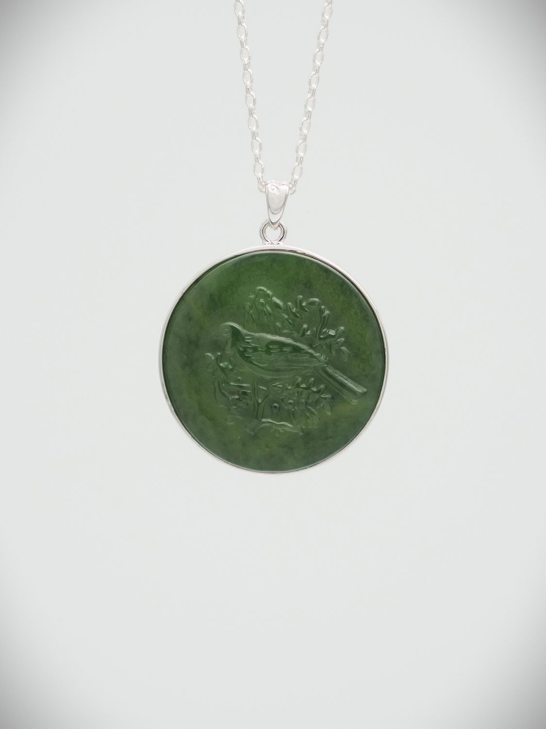 Moko Pounamu Greenstone and Sterling Silver Tui Coin Pendant