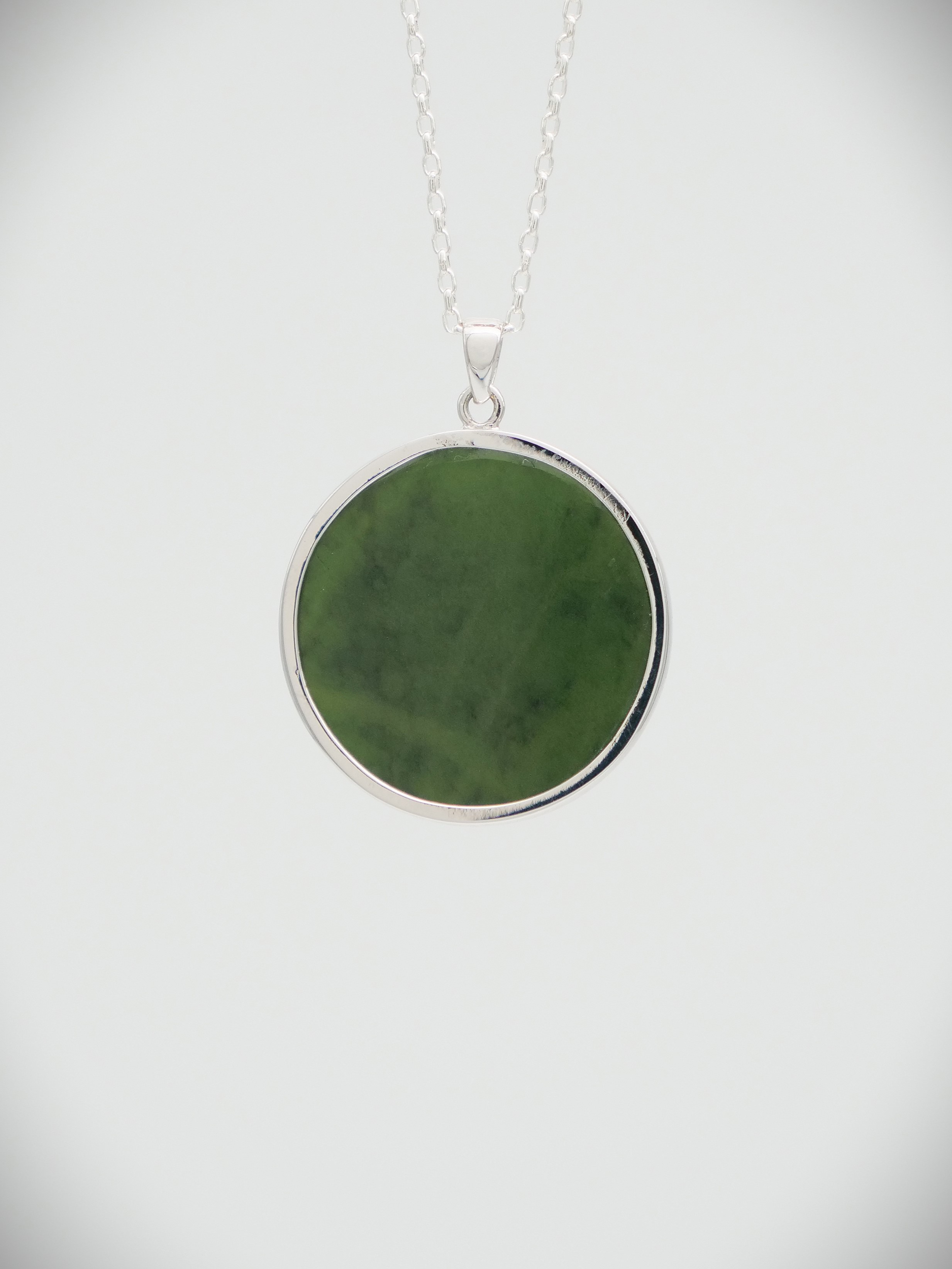 Moko Pounamu Greenstone and Sterling Silver Tui Coin Pendant