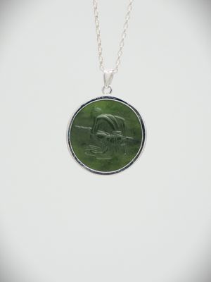 Moko Pounamu Greenstone and Sterling Silver Crouching Māori Warrior Coin Pendant
