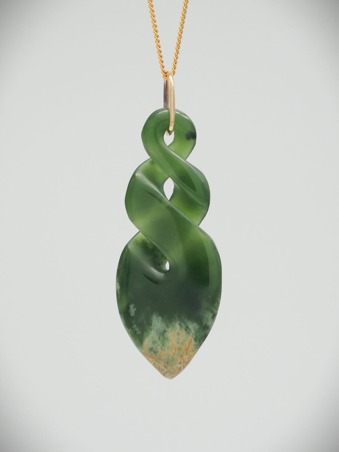 Moko Pounamu Double Pikorua (Twist) NZ Genuine Marsden Flower Greenstone and 9ct Gold Pendant - Ruakaka Moko Pounamu Double Pikorua (Twist) NZ Genuine Marsden Flower Greenstone and 9ct Gold Pendant - Ruakaka