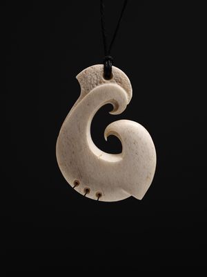 Moko Pounamu Hei Matau (Hook) Whale Bone Carving - Wharanui Moko Pounamu Hei Matau (Hook) Whale Bone Carving - Wharanui