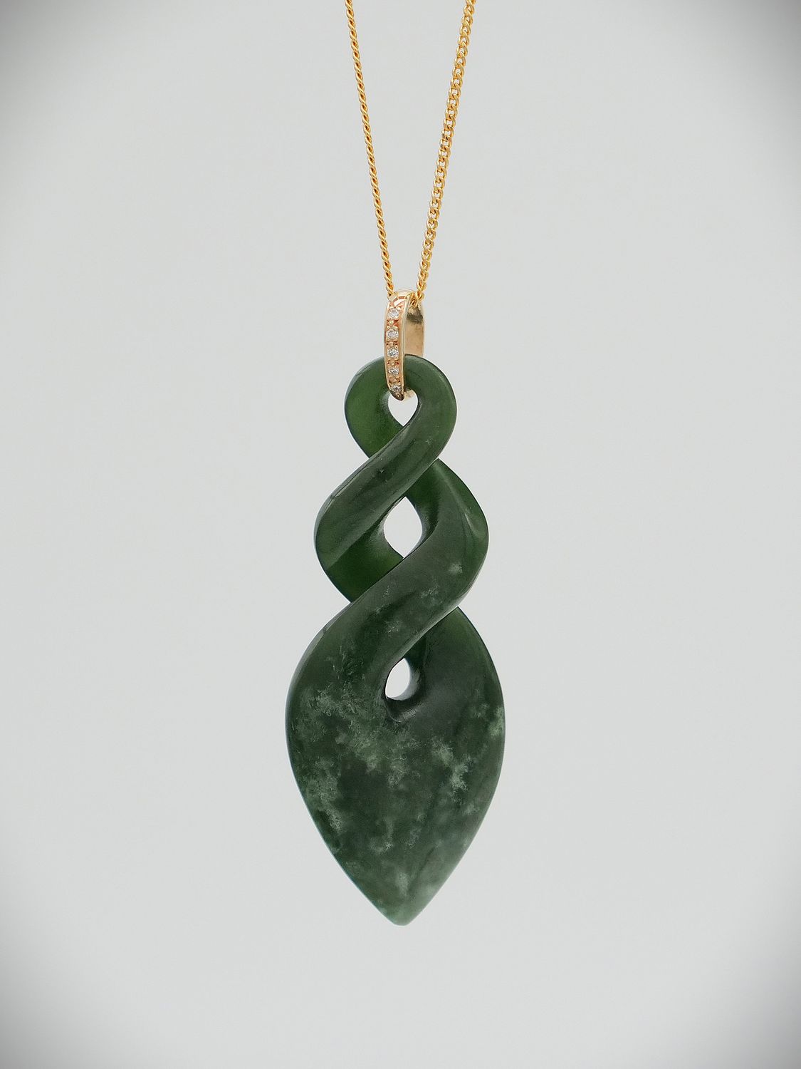 Moko Pounamu Pikorua NZ Genuine Kawakawa Flower Greenstone, 9ct Gold & Diamond Pendant - Mangamaunu Moko Pounamu Pikorua NZ Genuine Kawakawa Flower Greenstone, 9ct Gold & Diamond Pendant - Mangamaunu