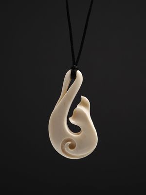 Moko Pounamu Whale Tail Bone Carving - Whitireia Moko Pounamu Whale Tail Bone Carving - Whitireia