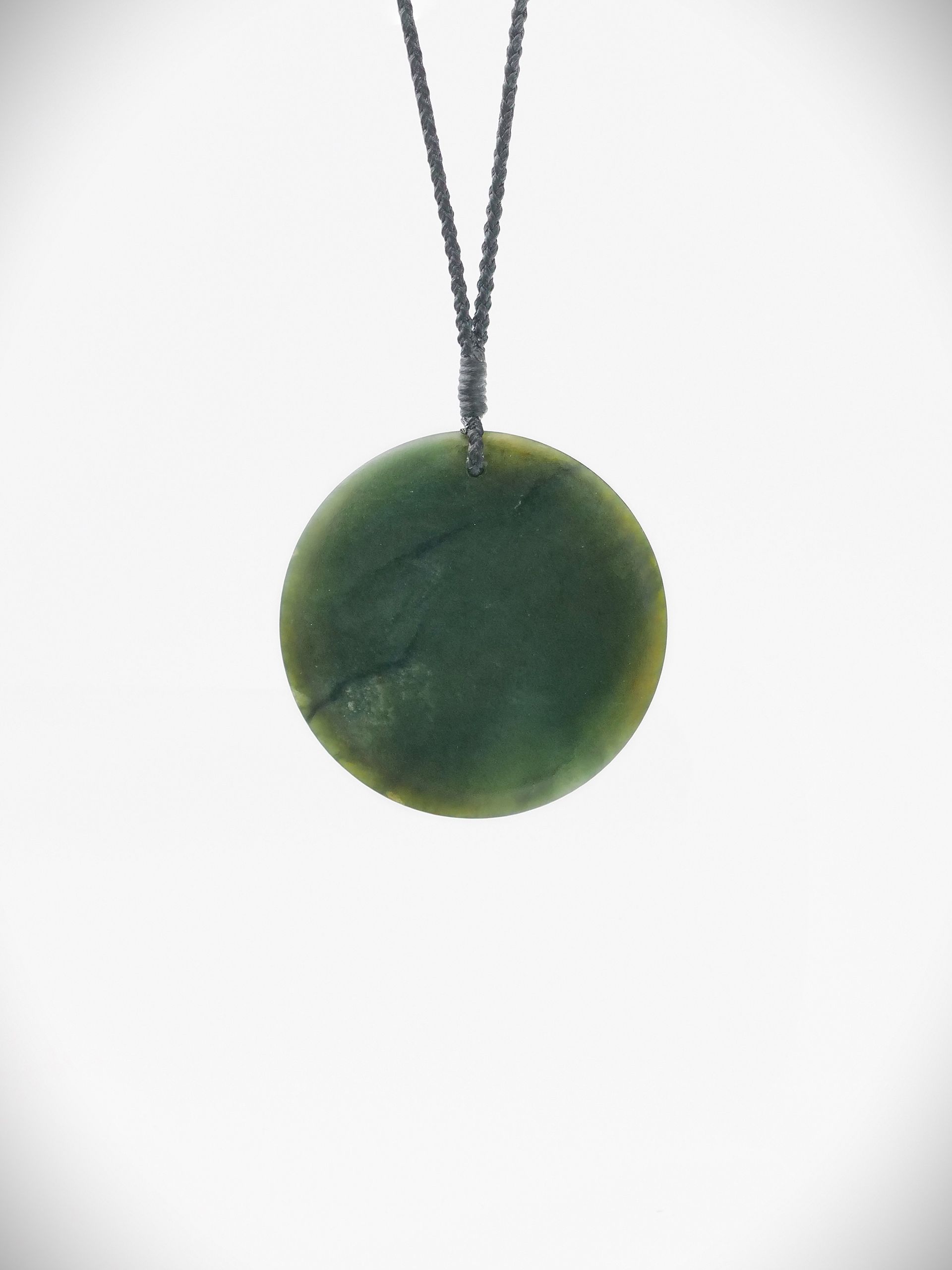 Moko Pounamu Porohita Disc NZ Genuine Kawakawa Greenstone - Putorino