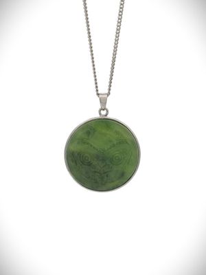 Moko Pounamu Greenstone and Sterling Silver NZ 10 Cent Coin Pendant Moko Pounamu Greenstone and Sterling Silver NZ 10 Cent Coin Pendant