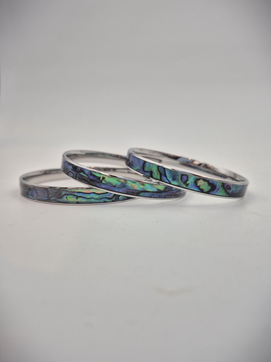 Moko Pounamu Stainless Steel and Paua Bangle 8mm Moko Pounamu Stainless Steel and Paua Bangle 8mm