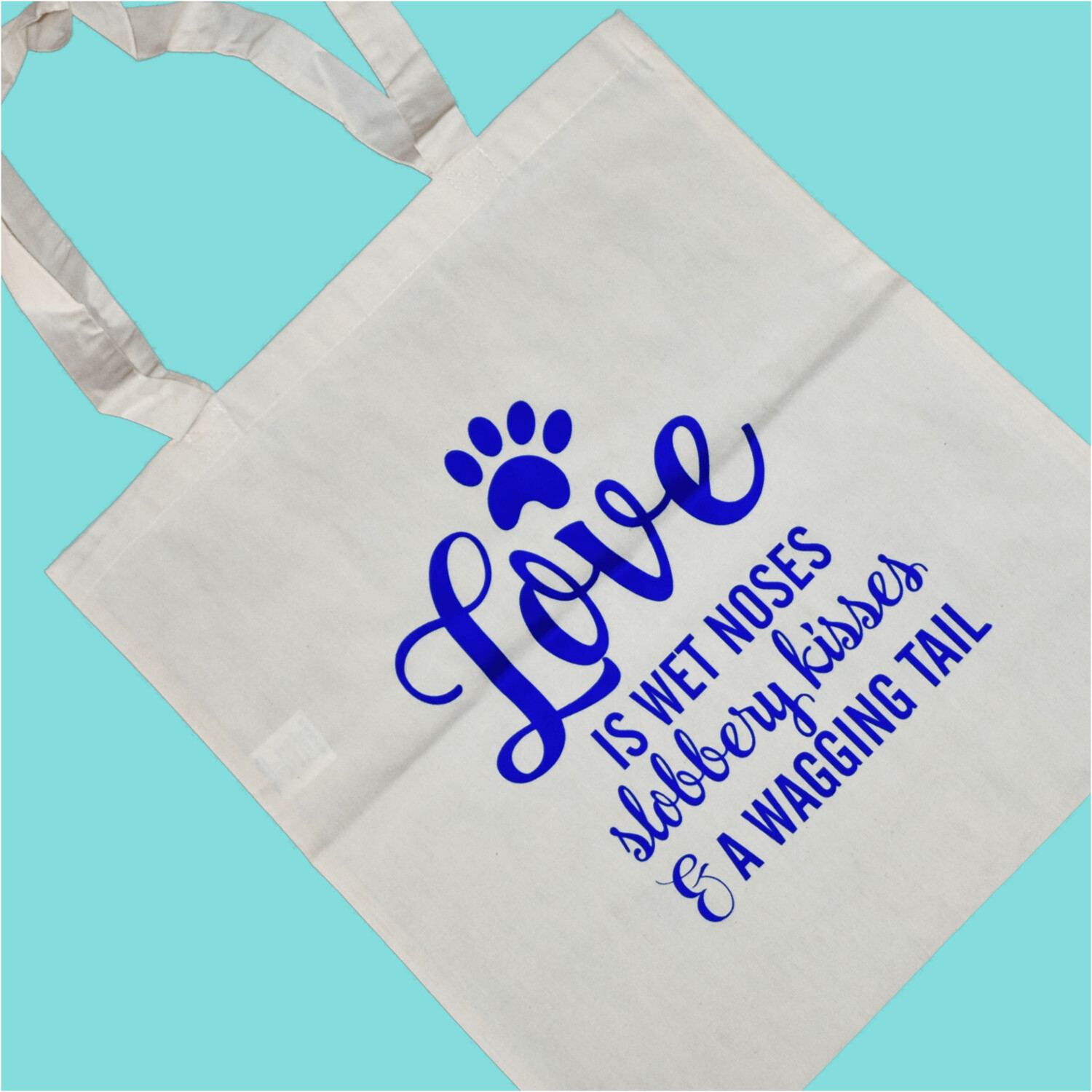 Love is wet noses, slobbery kisses and a wagging tail -Tote
