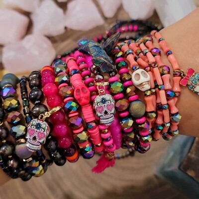 Peach coral bracelets with black rainbow glass beads La Catrina collection stack