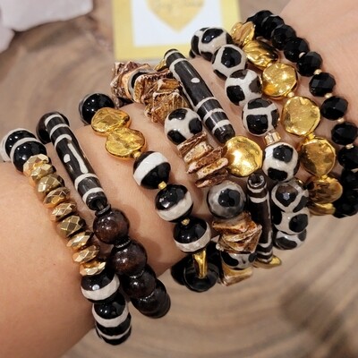 Dzi agates bracelet stack. Metal gold flat beads with black and white agates.