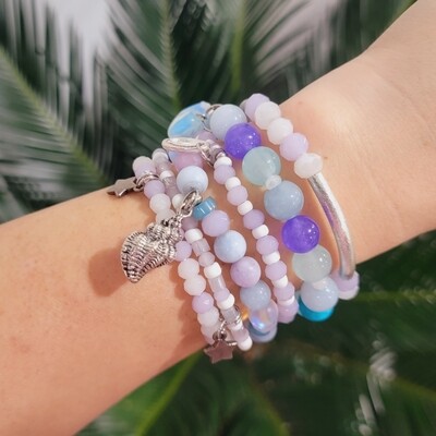 Mermaid stack with star and shell charms. Aquamarine, jade, ocean glass, mermaid glass and czeck crystals .