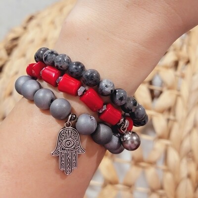 Red and black bracelet stacks with RED DYED TURQUOISE, RED CORAL , onyx, dalmatian, snow obsidian AND crystal  beads with 18k gold plated charm unique bracelets.