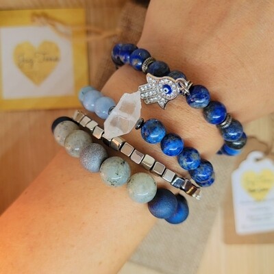 Evil eye bracelet stack. Blue and white tone beads