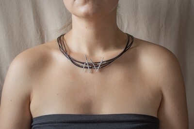 Modern necklace made of silver and caoutchouc