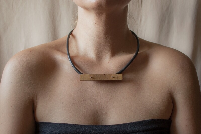Necklace made of wood, silver and caoutchouc