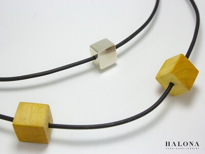 Necklace made of wood, silver and caoutchouc