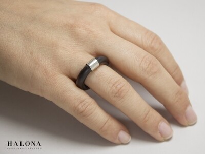 Geometric silver and caoutchouc ring.