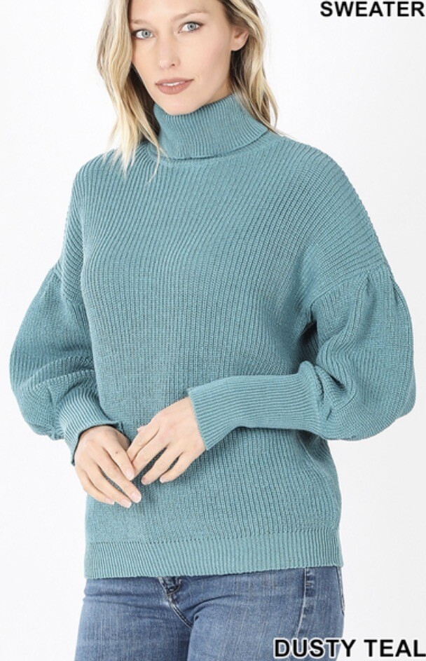 Sweater In A Turtleneck With Puff Detail On Upper Arm And Shoulder In Black And Dusty Teal