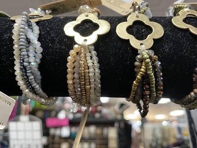 Bracelet-stretchy Beaded Multi Strand With Gold Center Piece In Multiple Colors