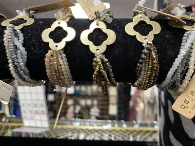 Bracelet-stretchy Beaded Multi Strand With Gold Center Piece In Multiple Colors