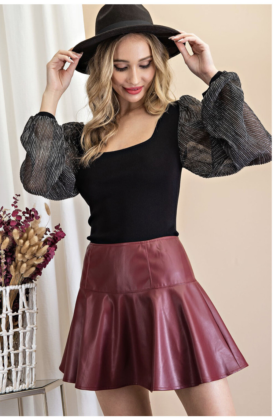 Shirt-black Square Neck Blouse With Sheer Gunmetal Puff Sleeves. 80% Viscose And 20% Nylon.   Model Is 5’8 Wearing A Small