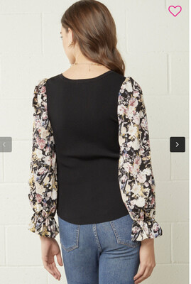 Shirt-Black Solid Bodice With Scoop Neckline And Sheer Floral Sleeves With Light Elastic Gathering At Wrist. 65% Viscose 35% Nylon. Model Is 5’10 Wearing A Small