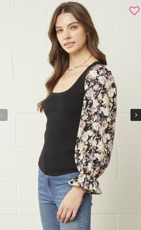 Shirt-Black Solid Bodice With Scoop Neckline And Sheer Floral Sleeves With Light Elastic Gathering At Wrist.  65% Viscose 35% Nylon. Model Is 5’10 Wearing A Small