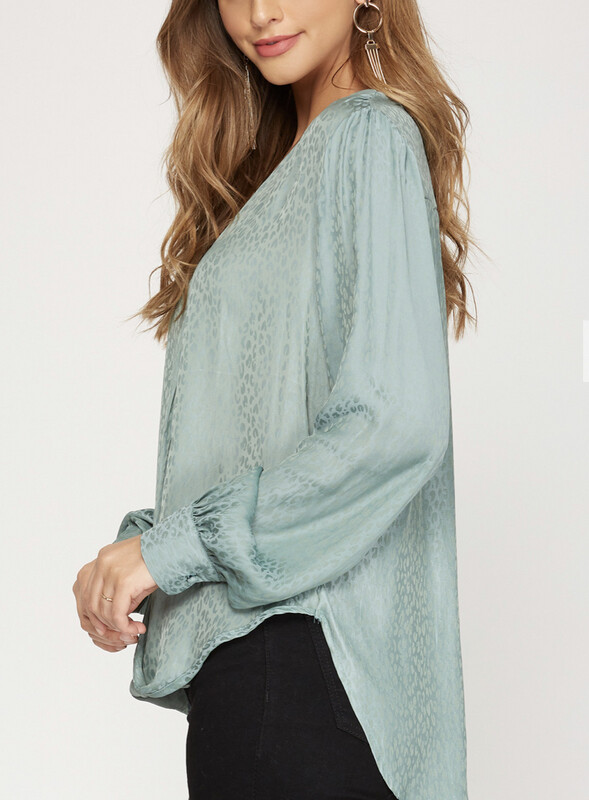 Shirt-Black And Slate Green Long Sleeve Front Surplice Satin Jacquard Top With Same Color Hint Of Leopard.  Model Is 5’8 Wearing A Small.  75% Polyester And 25% Rayon