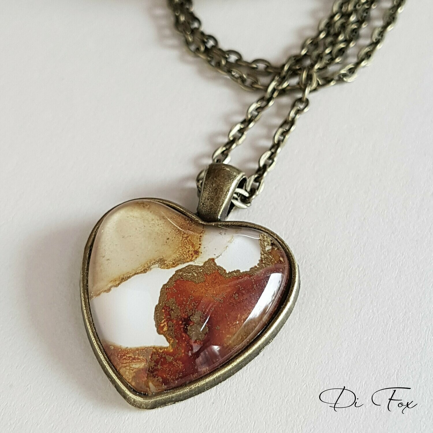 Caramel, Toffee, White and Gold heart shape Bronze pendant and chain.
