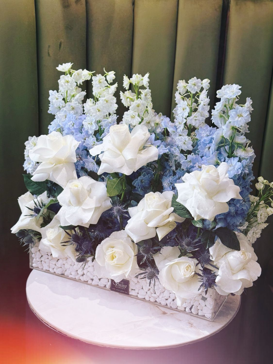 Blue delphinium with stone