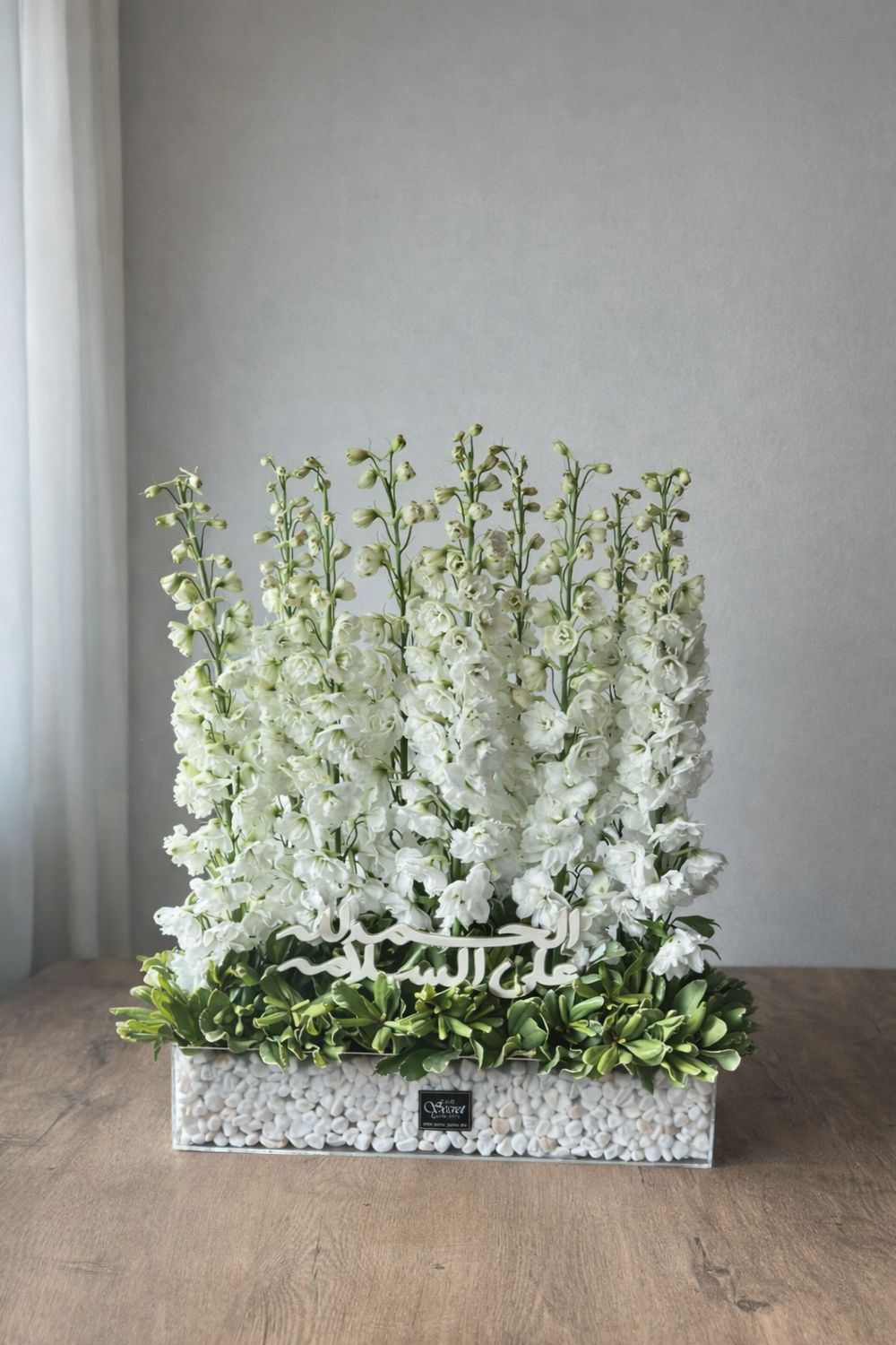 Blue delphinium with stone