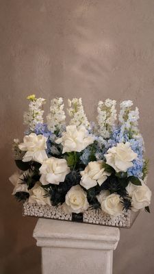 Blue delphinium with stone
