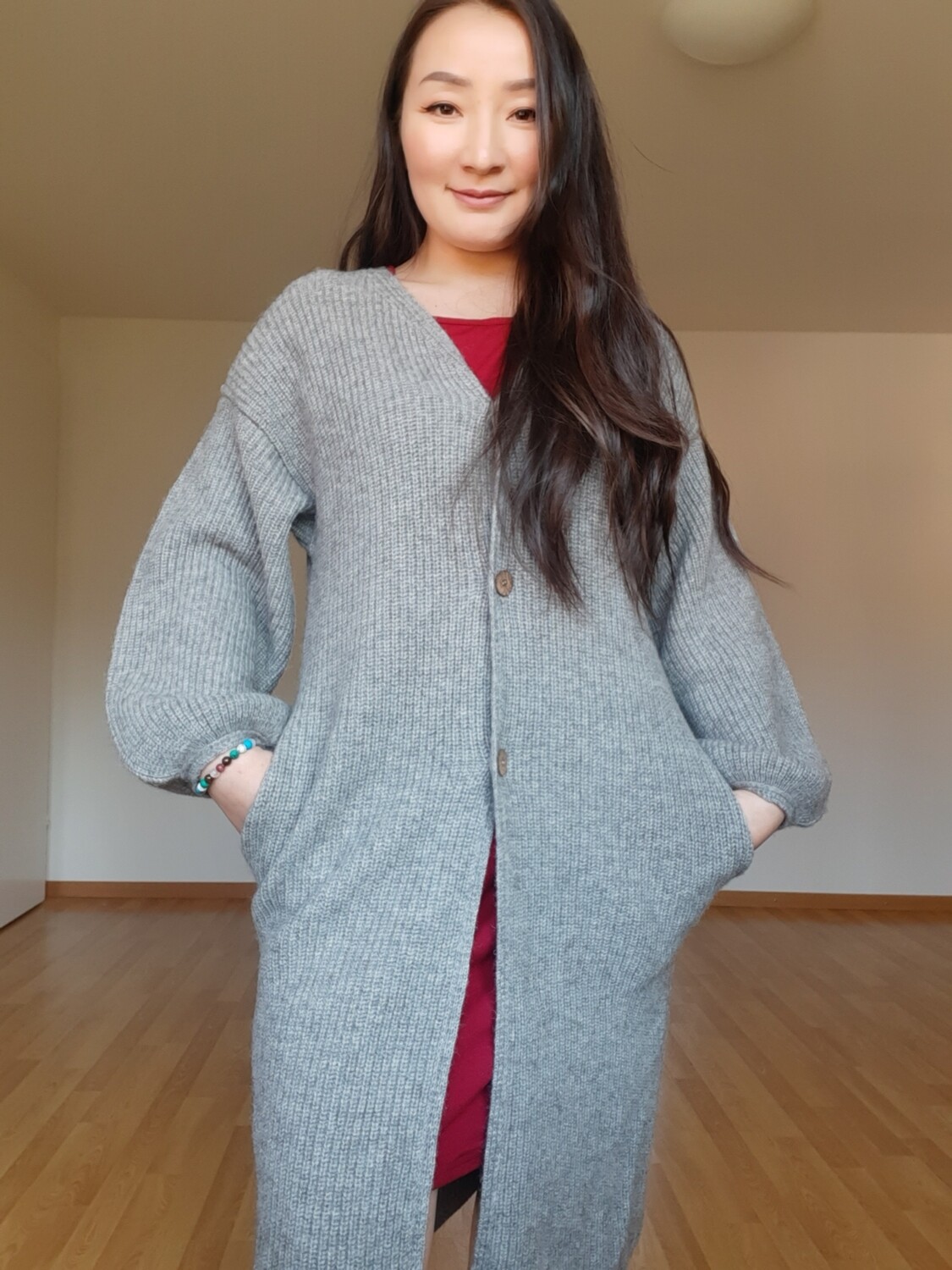 Mantel mit Ärmeln und Knöpfen