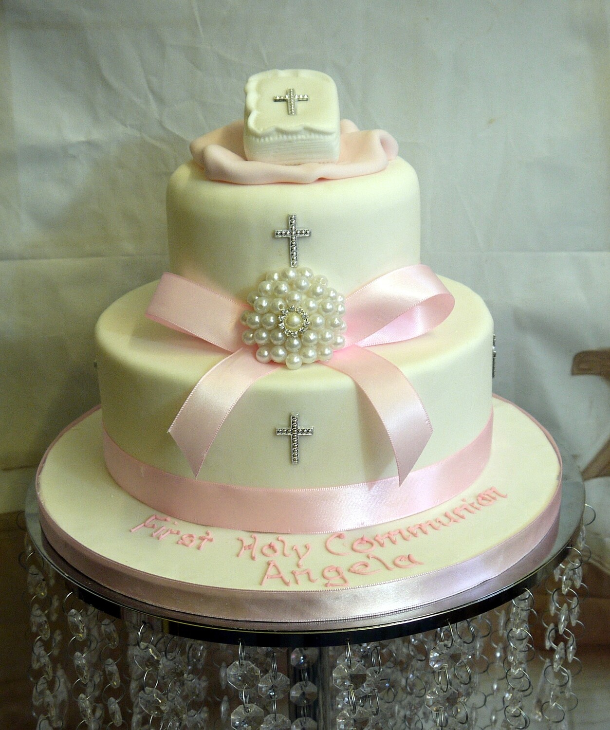 2 tier communion cake with ribbon bow