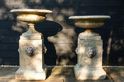 Pair of Doulton Lambeth terracotta Urns on Lion Head Plinths