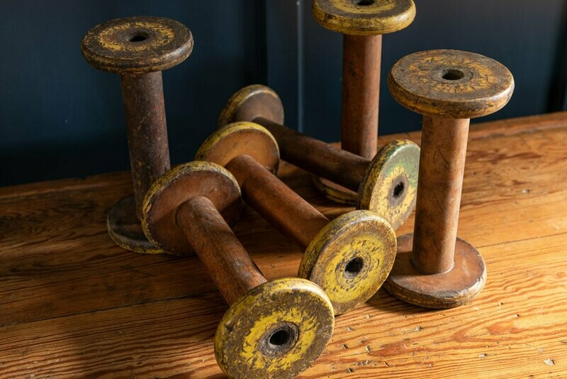 Collection of Factory Bobbins, yellow and green.