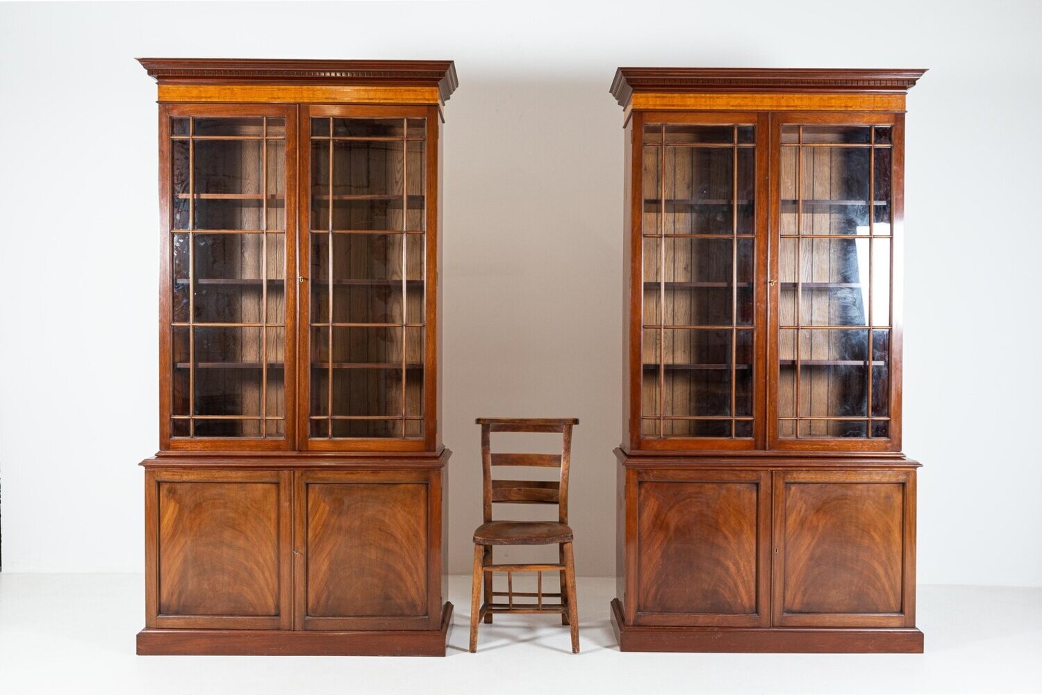 Pair of English Glazed Inlaid Mahogany Bookcases