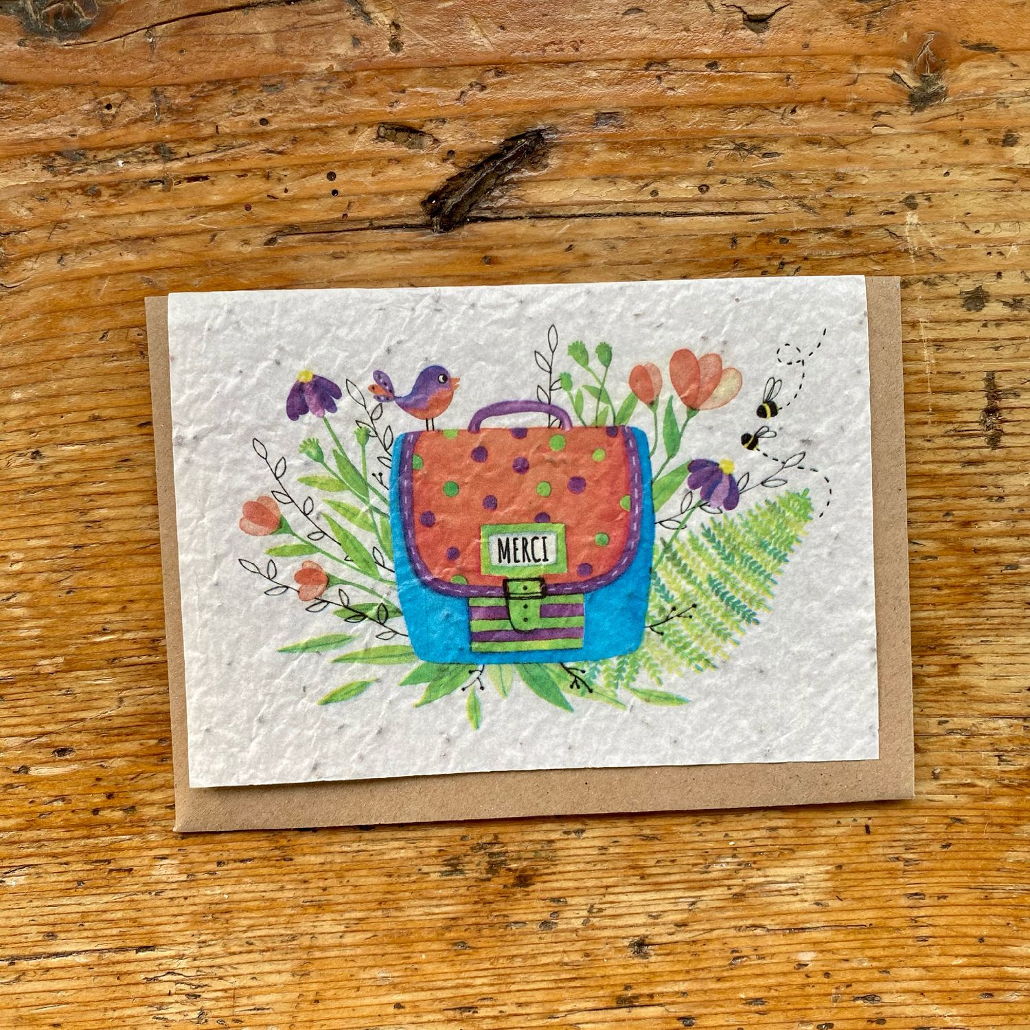 Carte ensemencée illustrée par un carte et merci à planter en graines de fleurs des champs pour remercier la maitresse ou le maitre ou l'atsem de vos enfants en fin d'année scolaire