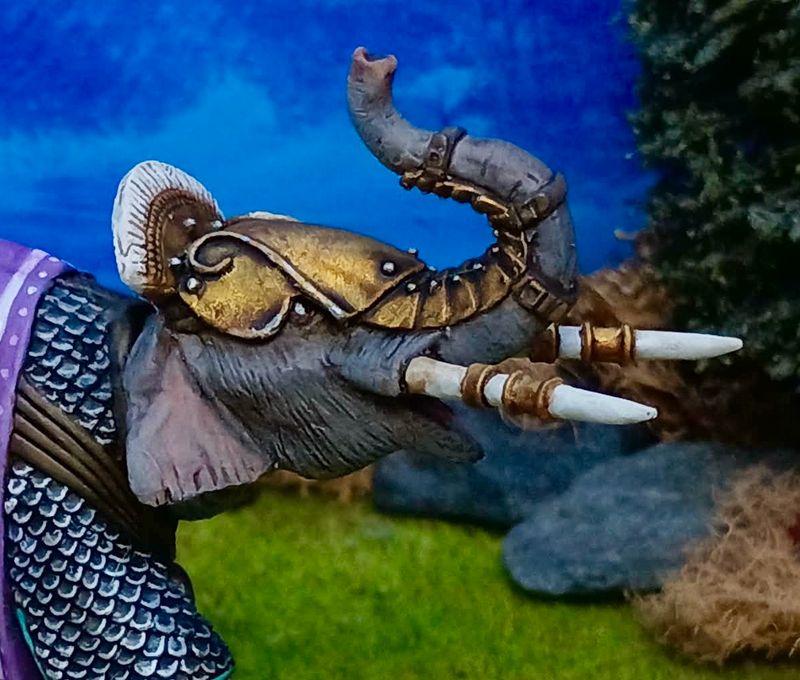 EH05 Armoured elephant head 3 with trunk raised.