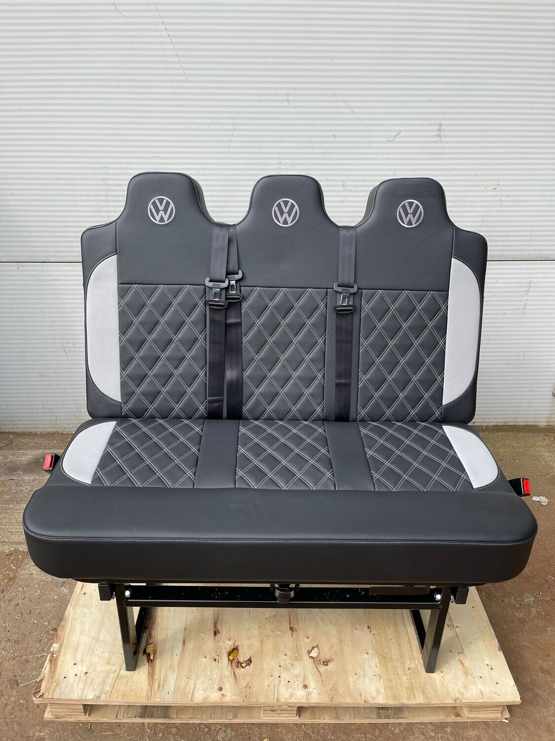 120cm 3 Seat Belt Rock n Roll Bed in Luxury Black Upholstery with White Cross Stitch.