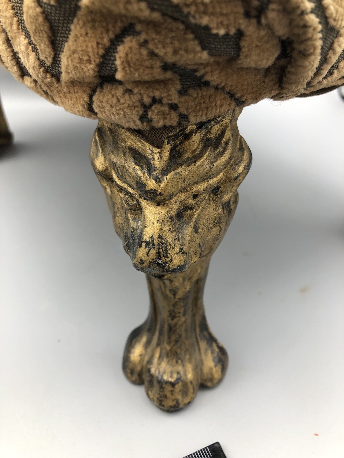 Antique lion head/paw footstool