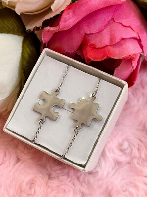 Coppia di bracciali Puzzle argentati