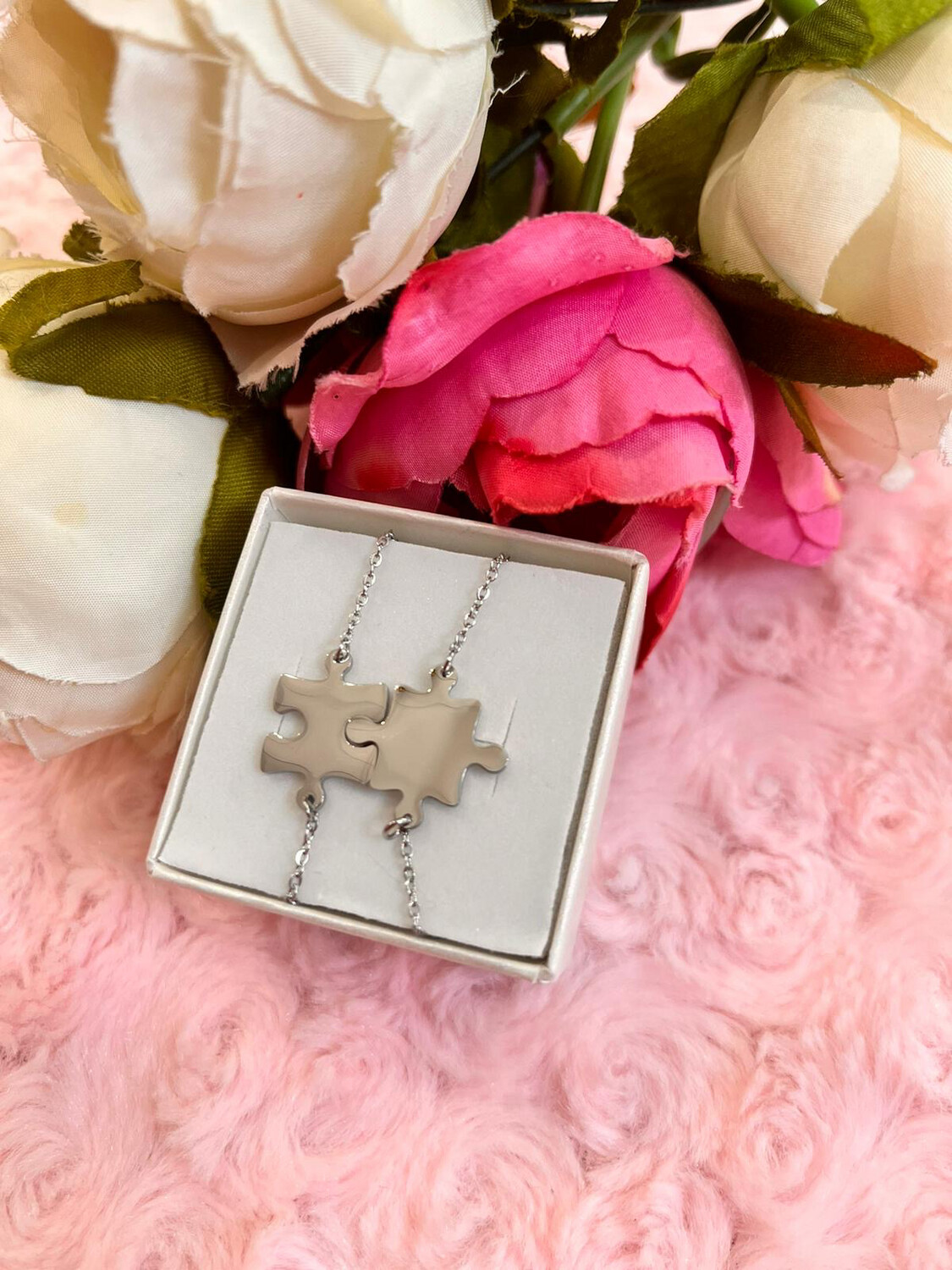 Coppia di bracciali Puzzle argentati