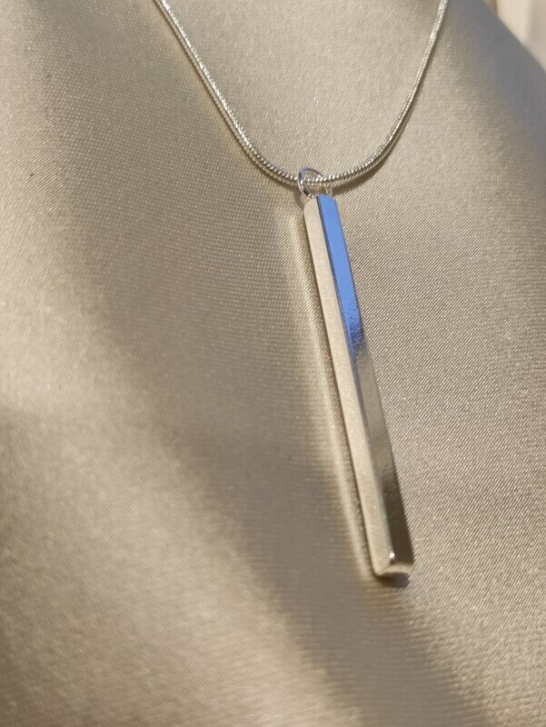 Colgante lingote de plata.