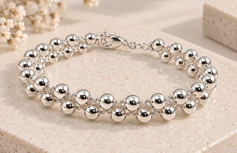 PULSERA BOLITAS DE PLATA.