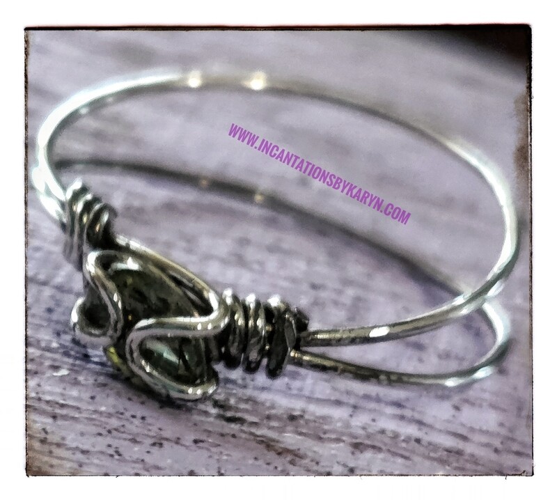 Peridot sterling silver tension set ring